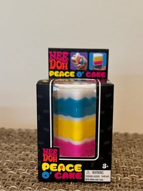 NeeDoh Peace O' Cake Layered Squishy Toy - White, Blue, Yellow, Pink
